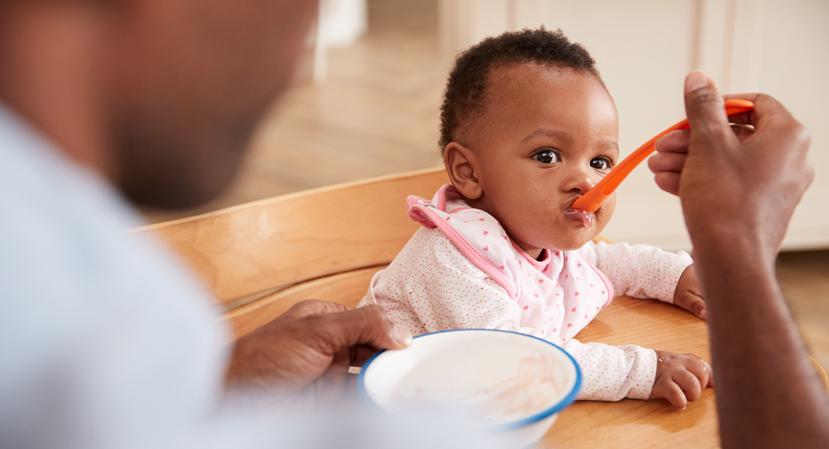 Father feeding baby