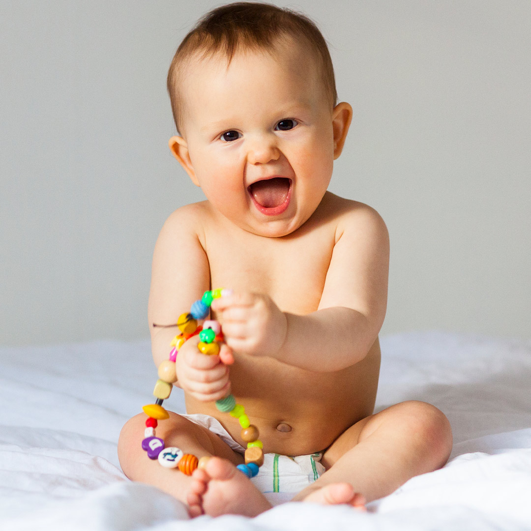 Banner baby playing with joy