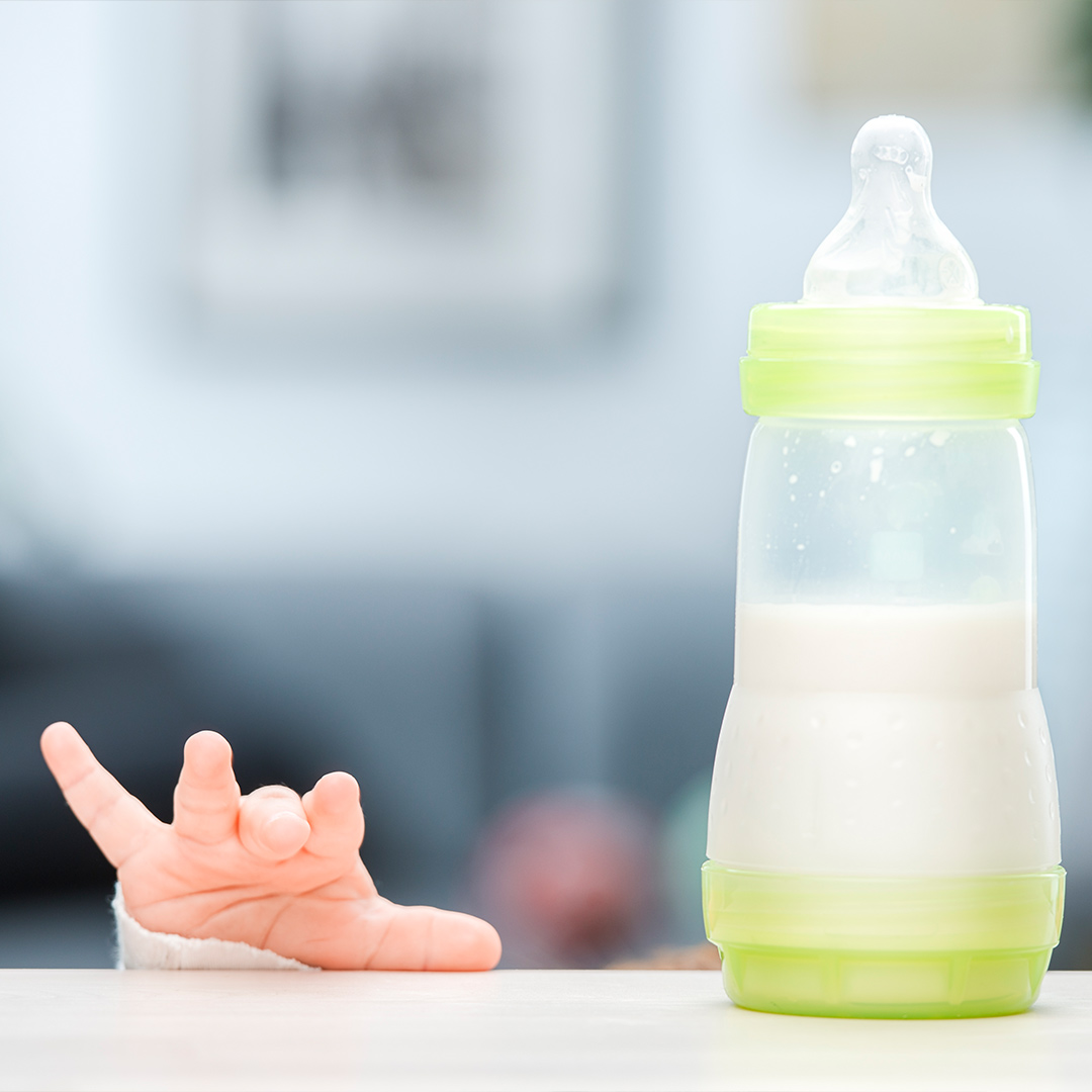 Banner hand and bottle