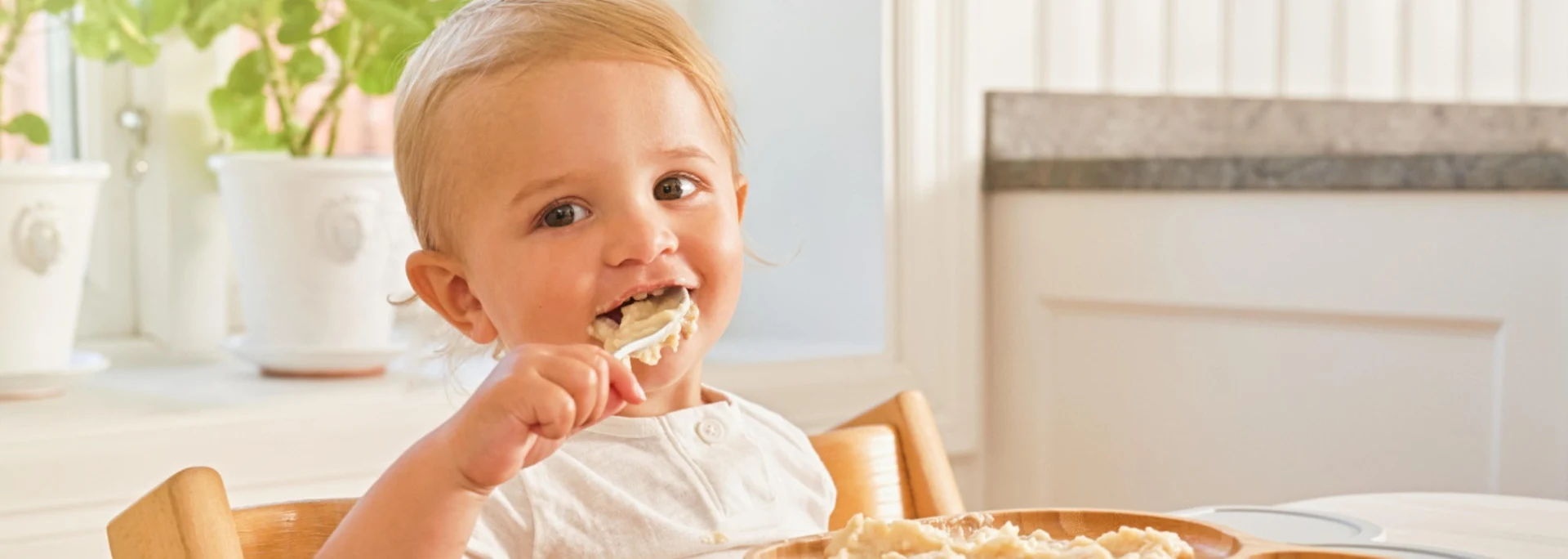 Baby eating porridge