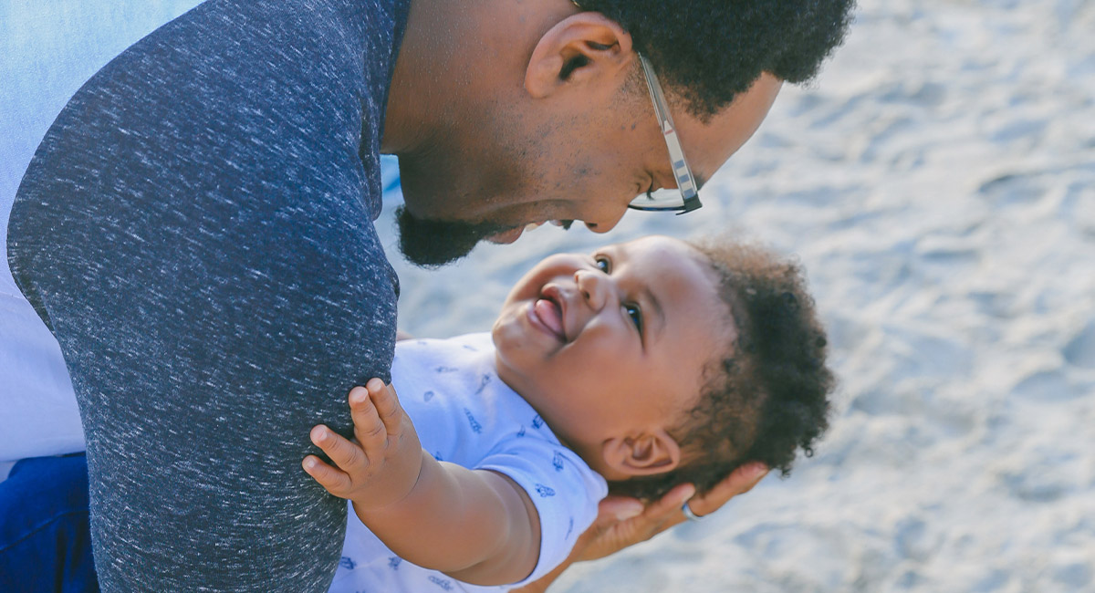 Father and child on beach