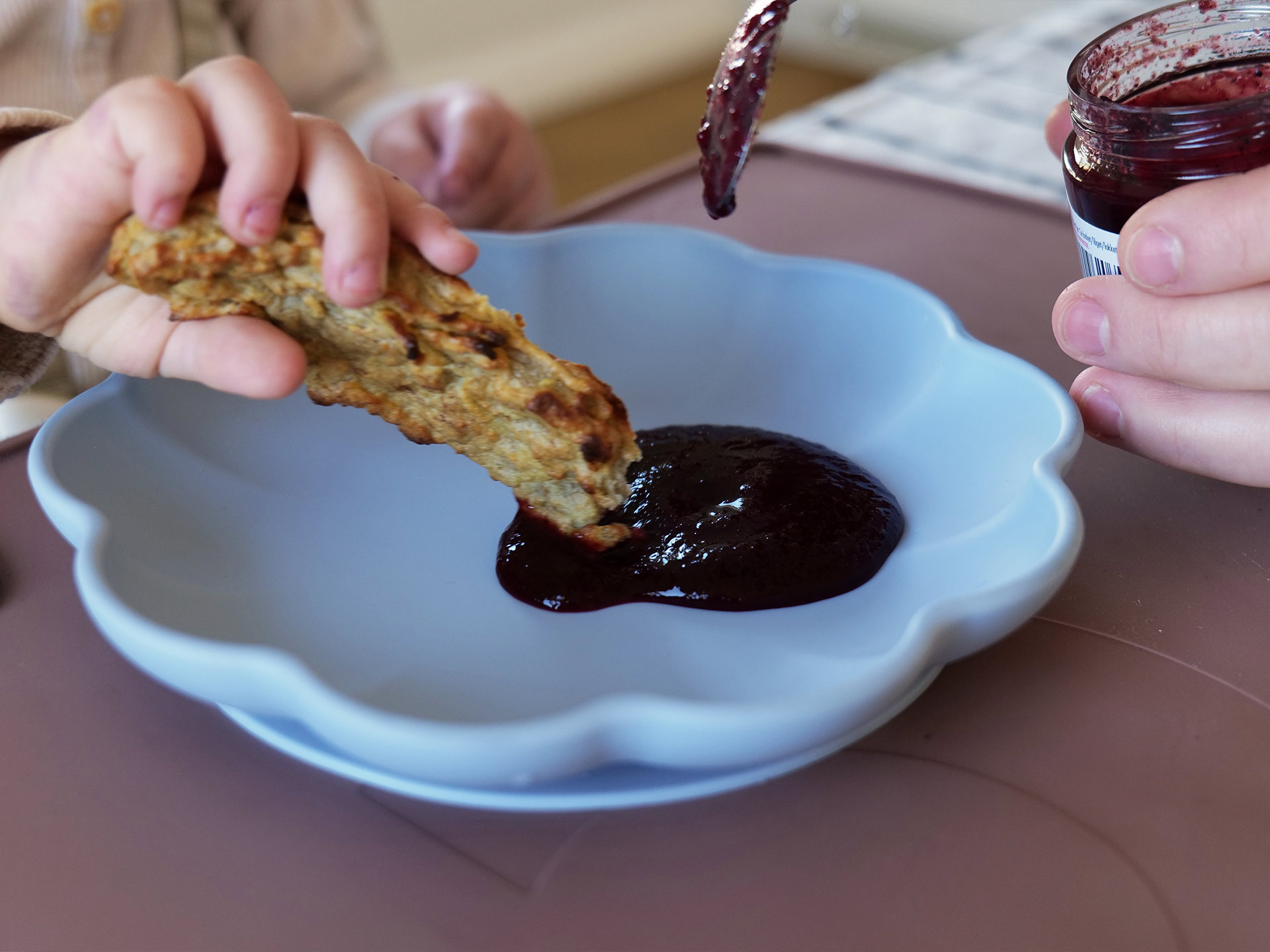 Dipping porridge sticks in puree